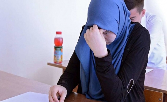 Kazakh schoolgirls face dilemma over head-scarf ban