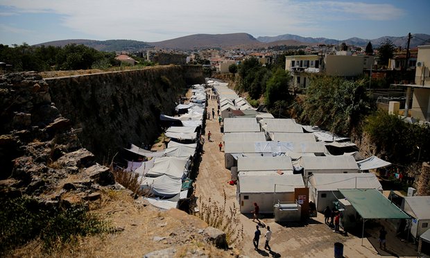Far-right group attacks refugee camp on Greek island of ChiosImmigrants in Greece face winter crisis after public sector cuts