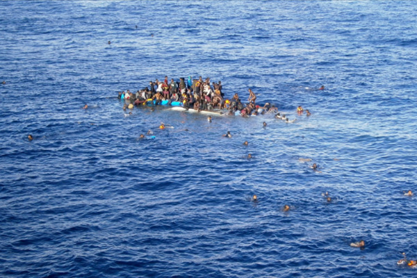At least 90 refugees drown in Mediterranean as boat capsizes off coast of Libya