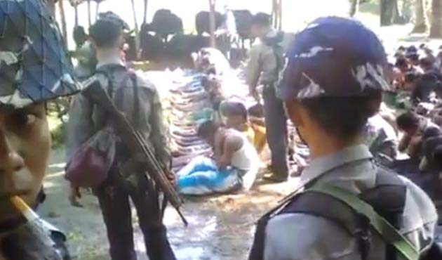 Myanmar to investigate video of police beating Rohingya villagers